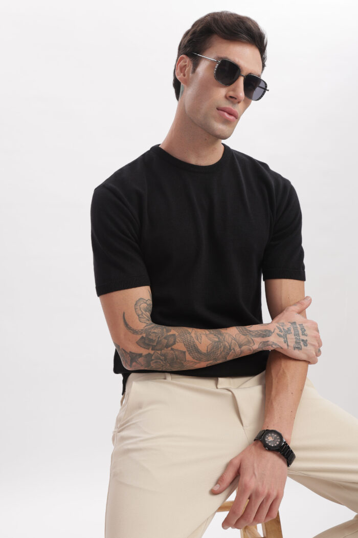 Model styling Black Onyx Crewneck from The Seasons' summer collection
